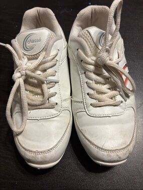 Classic white sneakers with orange stripe